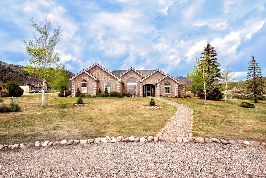 Welcome to the gateway of adventure! This home in Dry Fork Canyon doesn't just offer a roof over your head-it offers a lifestyle that most people only get to experience on vacation. Nestled on a 2-acre parcel in the historic and breathtaking Dry Fork Canyon, this 2,070 sq ft home is the perfect blend of comfort and self-sufficiency. Step through the covered front entry into this sanctuary with vaulted ceilings and natural light, this 3-bedroom, 2-bathroom home with a 2-car garage feels incredibly expansive. The kitchen is outfitted with a breakfast bar, gas stove, granite countertops, built in microwave, knotty alder cabinets, large stainless sink with rack and a high-end osmosis water softener system. Stay cozy with the ambiance of a wood stove insert (we're even leaving the some wood for you!) or enjoy the barefoot luxury of heated floors. The oversized master suite is a true getaway, and with walk-in closets in every bedroom, storage is never an issue. Relax under the custom pergola, perfectly set up for summer BBQs and starlit evenings. Features a fenced garden, a garden shed and two chicken coops, (shed and coop equipped with electricity), a full sprinkler system services the backyard, while dedicated drip lines keep the trees, bushes, and flowers thriving effortlessly. Why trailer your gear when you can live at the trailhead? Leave directly from your property on your side-by-side to explore endless canyon trails and the McConkie Ranch petroglyphs within Dry Fork Canyon.  You are a short drive to world class recreation, the Ashley Gorge Via Ferrata (the longest in North America!), premier mountain biking, and top-tier SUV trails, world-class fishing and boating at Flaming Gorge, Red Fleet, and Steinaker Reservoirs. Escape the hustle and breathe in the air of the high desert. This Dry Fork gem offers the rare opportunity to own a piece of Utah's cultural and natural heritage.  Buyer to verify all information and sq footage.