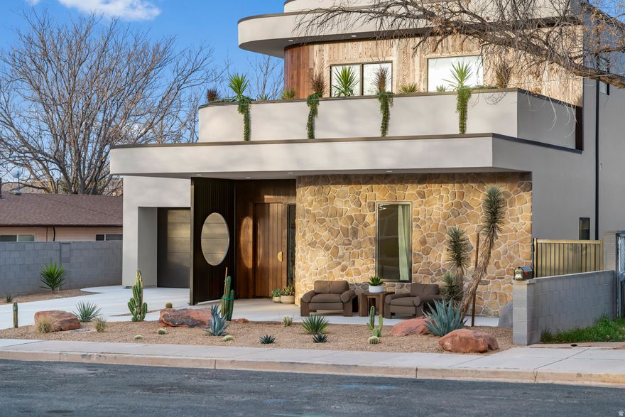 Experience late mid-century modern living in this architectural retreat in the heart of downtown, built by Wall2Wall Homes and designed by Dwellings Design. With a striking play on shapes, the home showcases clean geometry, bold lines, warm wood tones, and curated finishes throughout. The open-concept living space blends style and function. A detached ADU with a private yard space offers flexibility for guests, a private office, or rental income to offset costs. With a 2-car garage, dedicated ADU carport, and private sauna, this property seamlessly combines design, location, and opportunity. Don't miss the opportunity to own a thoughtfully designed home in downtown St. George!