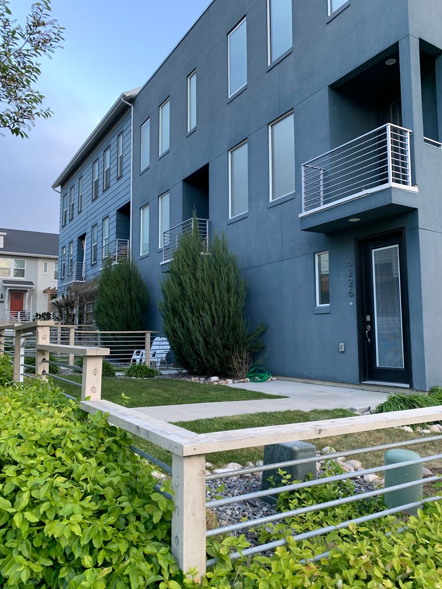 This beautiful end unit/corner lot townhome with private gated yard offers 2 bedrooms & 2.5 baths and open concept floor plan. It is loaded with natural light and thoughtful upgrades, granite countertops, metal banister/ cable railing, added kitchen island, exhausted vent (vent out), window shades and tinted windows in the entire house (window drapes all included). Garage door is insulated. Cozy and ready for you to move in. Enjoy the Daybreak Living-access to many parks, community pools, lake for kayaking, free community events, sport courts, bike park (Spoke Park), river walk and many trails.  Square footage figures are provided as a courtesy estimate only and were obtained from the county records. Buyer is advised to obtain an independent measurement