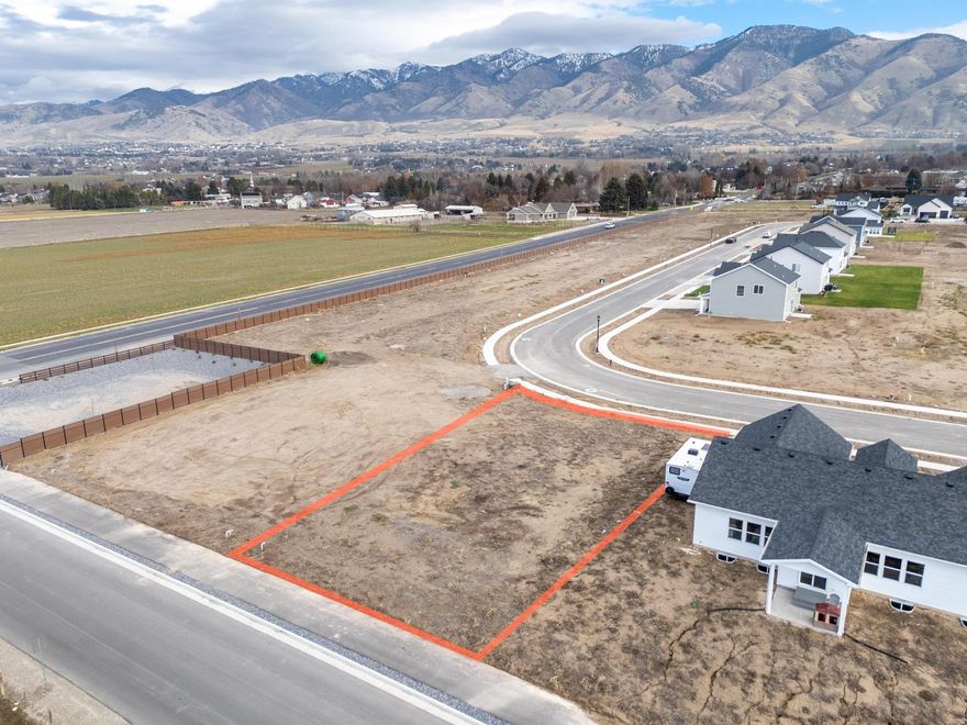 Lot # 3  Smiling H Subdivision is an inviting community located in the charming North Logan, Utah. This beautifully designed neighborhood offers a variety of amenities and features that cater to any lifestyle. Residents can enjoy the nearby recreational activities, include pickle ball courts, a splash pad for fun on warm days, and even an ice rink for winter sports enthusiasts. A public library and a police department nearby enhance the community's convenience and security. Families will appreciate the close proximity to schools, making it easy for children to access quality education. Additionally, every building lot is equipped with secondary water connections which is a big saver for the overall water bill. The availability of high-speed fiber internet provides residents with excellent connectivity for work and leisure. The fiber internet bill is part of the low monthly HOA fee of $65. Overall, Smiling H Subdivision offers a harmonious blend of nearby recreational opportunities and essential services, making it an ideal place to call home.
