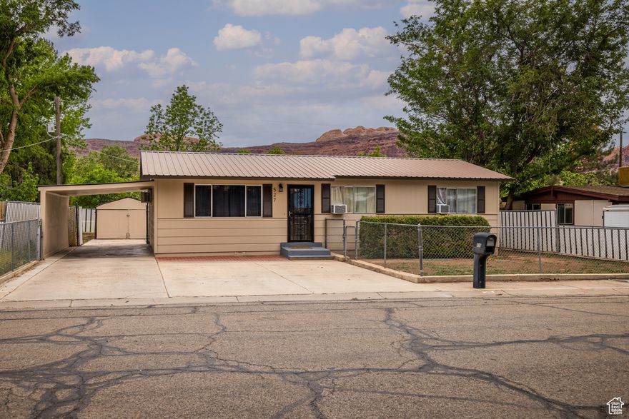 Well maintained 3-bedroom Rambler located in one of the area's most beloved neighborhoods! This charming home features fresh new siding, brand new interior paint, countertops, garbage disposal, exterior doors and dishwasher.  New LVP flooring professionally installed throughout.  The entire home has been prepared for turnkey buyer.  Enjoy the privacy of a fully fenced yard, perfect for entertaining or pets. The drive-through carport offers convenient access and extra parking, and you'll love the two spacious storage sheds-ideal for tools, hobbies, or additional storage. A great opportunity in a sought-after location!    Square footage figures are provided as a courtesy estimate only and were obtained from Grand County UT.  Buyer is advised to obtain an independent measurement.