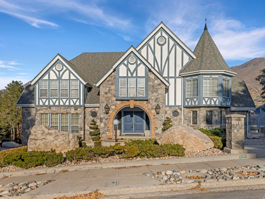 This property is being sold with 22-34-479-002, 2670 Bridger Blvd, a .35 acre lot, added to this .27 acre lot with the home giving us a total of .62 acreage. Welcome to 8585 Mount Majestic Road, Sandy, Utah - a rare estate offering unrivaled golf-front living and sweeping Wasatch Mountain views.  Perfectly positioned on Hole 8 with direct views of Hole 9 of the prestigious Willow Creek Country Club, this stately European-inspired residence sits on two full residential lots. Buyers may preserve the privacy and presence of the combined estate-or seize the unique financial opportunity of developing or selling the second golf-course-front lot included in the purchase price.  Built as the builder's personal home, the residence showcases 7,293 sq ft of quality craftsmanship and timeless architectural detail.  The expansive main-floor primary suite is both grand and serene, offering an extraordinary footprint that invites reimagining and personalized design to match your modern vision.  The impressive two-story great room is the centerpiece of the home, highlighted by dramatic wood beams and floor-to-ceiling windows perfectly framing panoramic views of manicured fairways and the majestic Wasatch Mountains. This is a room designed for gathering, entertaining, and appreciating the beauty that surrounds the property.  Upstairs, you'll find three additional bedrooms, two bathrooms, and a massive office-large enough to serve as an additional bedroom or creative flex space. A private second-level deck extends from this room, providing an elevated vantage point over the course and mountains.  Step down to the unfinished lower level, offering a blank canvas to design the ultimate recreation or entertainment space. Whether your vision includes a home theater, gym, game room, or additional living quarters, this expansive space provides limitless possibilities.  The 4-car garage features an shop area and separate door between 3-car parking and 4th "project" car parking complete with steel beam support chain engine lift.  This 4th car garage could easily be converted to a 6th bedroom if sleeping accommodation needs exceed that of a 4th car parking.  The seller currently has converted 380 sq ft of the home into this 4th car/workshop, which can be converted back to house sq ft. Outside, the estate truly shines. Expansive terraces and patios overlook the golf course, offering the perfect backdrop for outdoor dining, entertaining, or simply enjoying quiet mornings with panoramic mountain views. Meticulously landscaped grounds provide privacy and elegance, while the estate's placement on two lots enhances both space and opportunity.  8585 Mount Majestic Road combines grandeur, location, and flexibility like few properties can. From the sweeping views of the Willow Creek fairways and Wasatch peaks to the thoughtful layout that balances entertaining and everyday living, this home invites you to live your dream in one of Sandy's most prestigious settings at a price that is conducive to an update remodel and still maintain plenty of equity. >>>