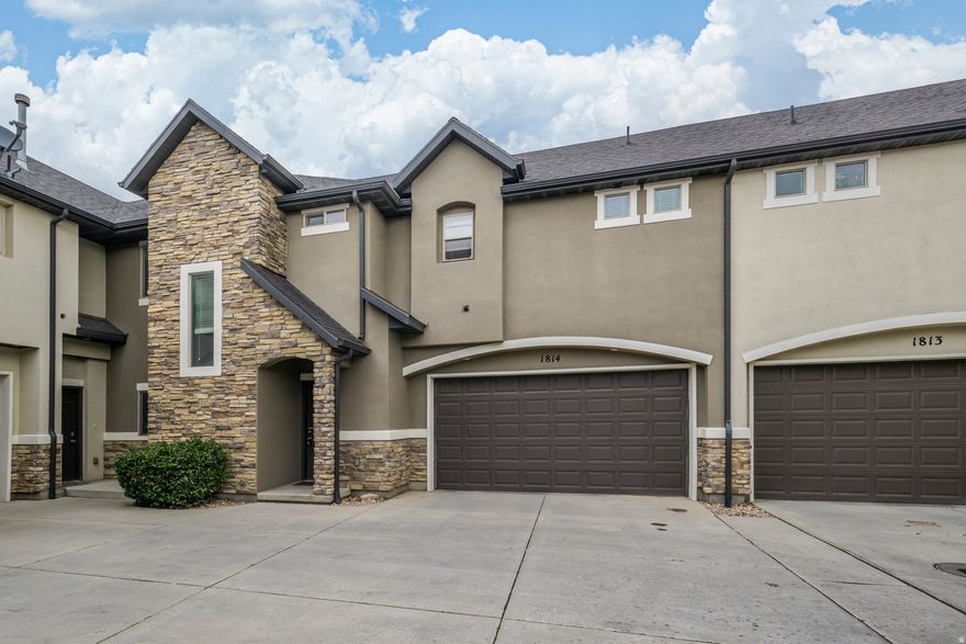 Welcome home to this Gorgeous, Updated Townhome in the highly desirable Valentine Estates community of Woods Cross. Fresh paint and new luxury vinyl plank flooring create a seamless, upscale aesthetic throughout the entire home.  Spacious Primary Suite with vaulted ceiling, oversized walk-in closet and updated bathroom featuring new shower and tub. Newer water heater, water softener and reverse osmosis. A generous garage includes space for both parking and storage, while the private, fully fenced backyard offers an inviting retreat. Residents enjoy exclusive community amenities including a sparkling pool and two parks. Ideally located with quick access to I-215 and I-15, this home places you minutes from downtown Salt Lake City and the International airport. Bring your pickiest buyers - This one is stunning! Buyer to verify all info.