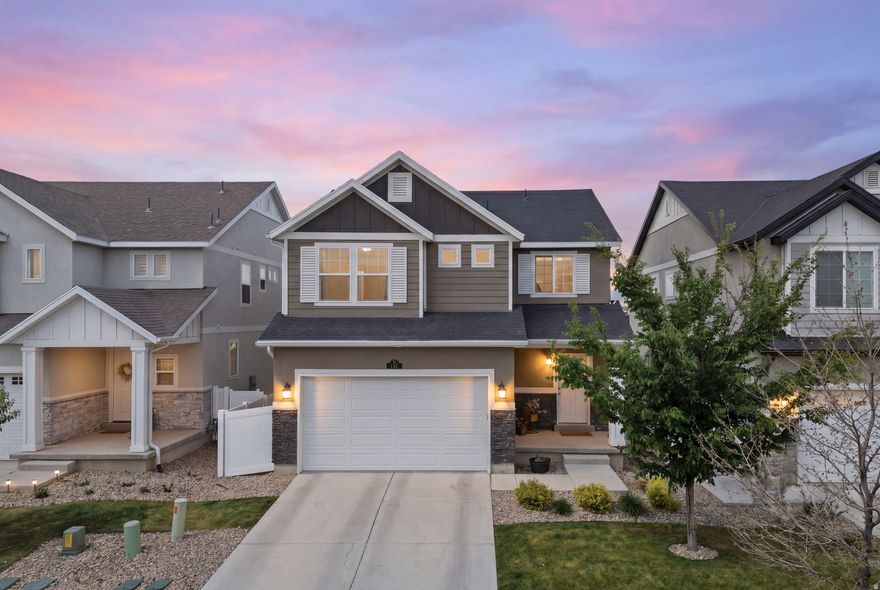 This is the Lansford plan from Oakwood Homes, and if you've looked around the community at all, you already know... you can't just go build this one anymore, which makes this one a bit of a unicorn if you like having something a little more intentional.  The main floor is bright, clean, and open, and just feels good the second you walk in. The kitchen anchors everything with a big island, plenty of storage, and space that actually works for whether it's a quick weekday dinner or people over on a weekend. Upstairs is where this one quietly wins. The bedrooms are bigger than what you'll typically see in this price range, which after until you've walked a few homes nearby, you'll realize how rare that is. Out back, you've got a finished yard, covered patio, and a straight-on view of the temple that hits especially well at sunset.  And location-wise, you're tucked by the Jordan River Parkway Trail and Utah Lake, so getting outside is easy whether it's a walk, run, or bike ride.