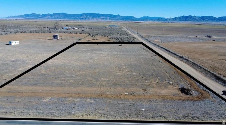 Rare opportunity to own 1.31 acres near Beryl Junction with paved Highway 18 access and 1 AF of valuable water right (#71-3536). Recently cleared and ready to use. This property includes a shared well agreement with the parcel to the North, which has recently installed a brand-new well for connection. A septic tank is already in place, with power nearby approximately 75 feet to the Northeast. Ideal for a primary residence, second home, cabin, or private family retreat. Enjoy wide open views, dark skies, and rural freedom with quick access to town. Located just 10 minutes from Enterpris