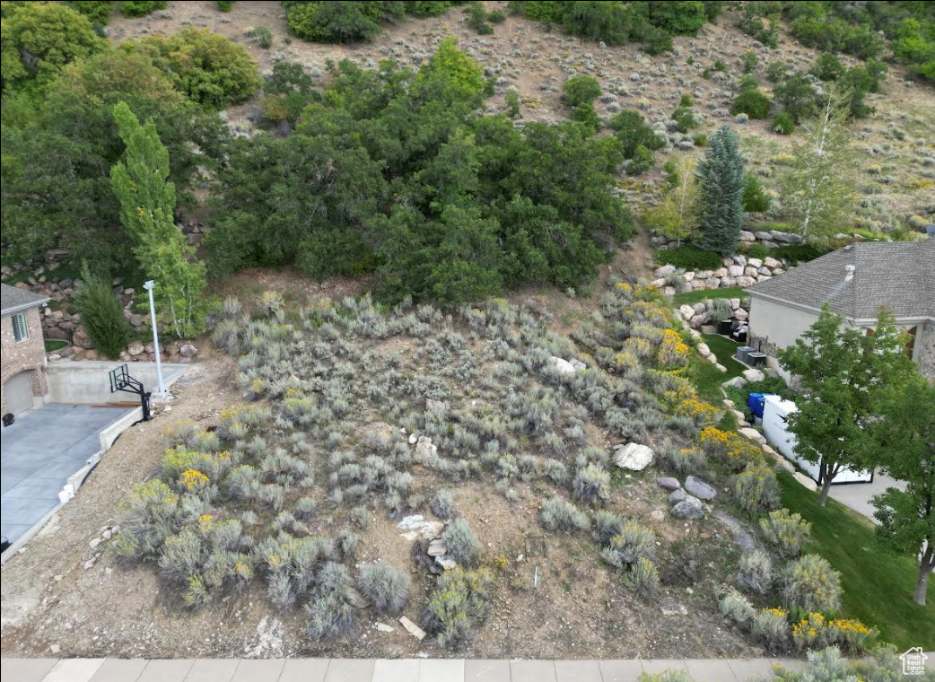Welcome to your dream homesite on the prestigious Bountiful bench! This .66-acre lot offers a rare opportunity to build your custom sanctuary with sweeping views of the valley and lake below. Enjoy stunning sunrises and sunsets from this elevated perch while still being just minutes from local amenities, schools, and downtown Bountiful. Utilities are stubbed to the lot for added convenience, making your build process that much easier. Come experience the perfect blend of tranquility, accessibility, and natural beauty. Acreage figure is provided as a courtesy estimate only and obtained from county records; buyer is advised to obtain an independent measurement.