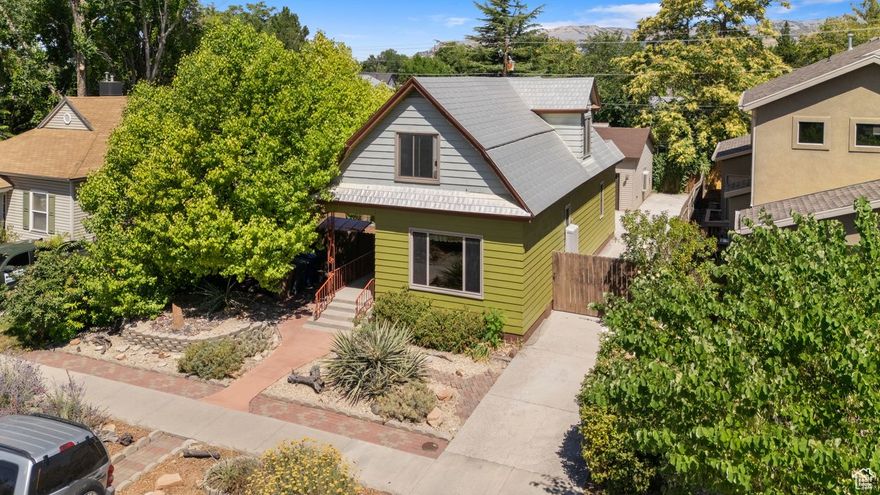 *NEW PRICE!* ADORABLE 2-STORY with HISTORIC CHARACTER, high ceilings, newer double-paned windows & a cute balcony from upstairs bedroom. RARE for Sugarhouse. Previous owners built 33k garage 2.5 years ago. HEATED /cooled 2 CAR EXTENDED GARAGE both length and width+ and RV Hook up! Extra Parking! Tons of shelving & storage, ready to have a PARTY, WORKSHOP or both in winter and summer. Main floor bath remodeled 8/25 plus new fixtures. 2022 Remodeled kitchen with stainless appliances & countertop. Professionally painted Light and Bright first and second floors plus the exterior, also new carpet. The house is ready to have central air installed. A MUST SEE! Fabulous LOCATION! Walking distance to SUGARHOUSE PARK, Westminster College, McClelland Trail, 9th & 9th downtown Sugarhouse. Easy Access to Big & Little Cottonwood Canyons and Parleys Canyon. Xeriscaped front yard with secluded & shaded patio in the backyard, raised garden beds and berry bushes. In past recent years updated electrical, new main waterline in 2015, partial sewer line in 2008. $30,000 in improvements and cosmetic upgrades July 2025. Buyer to verify all.