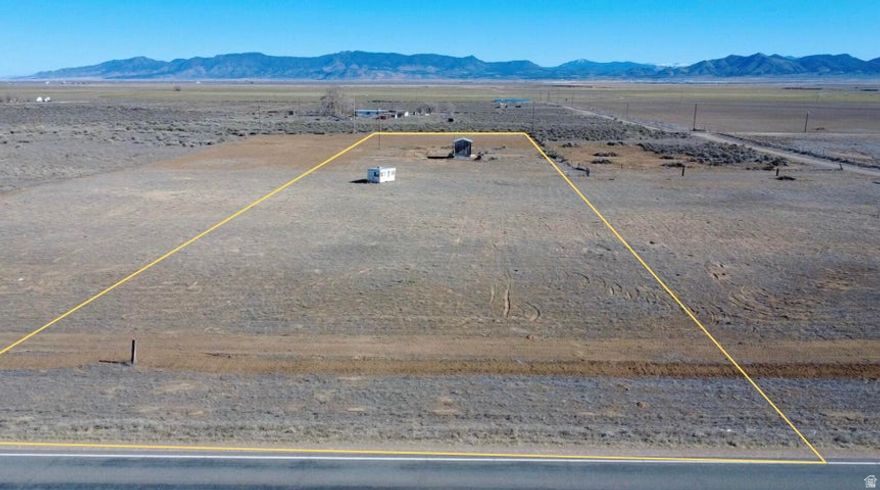 Rare opportunity to own 2.11 acres near Beryl Junction with paved Highway 18 access and 1.22 AF of valuable water right (#71-3536 0.72 AF & #71-5915 0.50 AF). Recently cleared. This property includes a shared well agreement with two other lots and a recently installed brand-new well (located on this lot). Power is already connected to this property. Ideal for a primary residence, second home, cabin, or private family retreat. Enjoy wide open views, dark skies, and rural freedom with quick access to town. Located just 10 minutes from Enterprise for gas, groceries, schools, and medical services, and under an hour to Cedar City and St. George. A versatile property with infrastructure, water, power, and accessibility already in place. Come take a look.