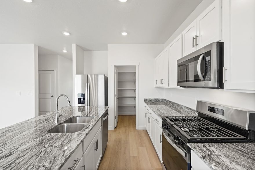 This beautiful home's cohesive great room, dining room, and kitchen make entertaining easy. Upstairs, unwind in the primary suite with a spacious bathroom and walk in closet. Move in ready with a washer, dryer, fridge and blinds throughout! Unfinished basement included. Total home approx. sq. ft. 3,411.