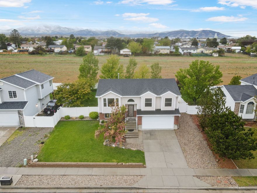 This one checks all the boxes - and then some. Recent updates throughout including a Newer Roof, Furnace/Central Air, Water Softener, Updated Primary Bath,  Fridge and Washer / Dryer included.  Fire up the grill on the deck, relax on the patio, and enjoy your evenings with no rear neighbors looking in, fully landscaped and mature trees.  Need space for projects or extra storage? The garage workshop and included shed and RV Parking have you covered. Best of all, you're just a short drive from the amphitheater - summer concert season has never looked so good. Come see it before it's gone.