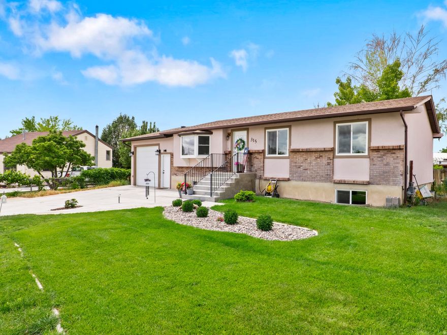 **Back on the market and better than before! If you've seen this home previously, it's worth another look. Since being listed, the sellers have completed several updates, including new flooring, drywall and paint improvements downstairs, along with newly established grass in the backyard that continues to mature and fill in.** Welcome home to this well-maintained property offering comfort, functionality, and room to grow. The main level features updated flooring that flows throughout the living spaces, creating a warm and inviting feel. The kitchen is move-in ready with all appliances included, making the transition into your new home easy. One of the standout features is the spacious back deck, perfect for entertaining, relaxing, or enjoying quiet evenings outdoors. Exterior lighting adds both style and fun with customizable colors for holidays, special occasions, or cheering on your favorite team. The primary suite offers a walk-in closet, private  bath, and direct access to the deck, creating a peaceful retreat. Downstairs you'll find a large family room, an additional bedroom, bathroom, den, laundry area, and generous storage space, along with a walk-in soaking tub that adds both comfort and convenience.  Located within walking distance of the high school and situated in a welcoming neighborhood, this home has been lovingly cared for over the years and is ready for its next owner to make it their own.