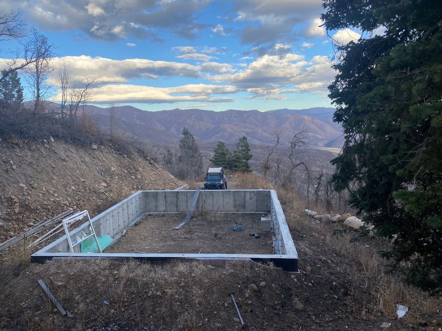 Breathtaking Views!  Don't miss out on this wonderful lot with over 25K in improvements.  Includes a 8 inch foundation, perfect for a block home, or double 2x4 walls.  This is an amazing opportunity to build a cabin in the beautiful Wasatch mountains in a secure, gated community!  The property is located in the Left Fork of Hobble Creek Canyon in a recreational seasonal development.  It's a wooded property with a variety of thick trees including Aspen, Pine, Maple & Scrub Oak, ferns, and wildflowers.  Deer and wild turkey trails run through the property. There are so many outdoor recreational opportunities in this development, and in the canyon, with hiking trails, horseback riding, 4 wheelers, and snowmobiles, and fishing too!  Make wonderful memories for a lifetime in the great outdoors! Just 15 min from Hobble Creek Golf Course and 20 from shopping! Winter Access after the holidays is by snowmobile. All info is deemed reliable but not guaranteed. Buyer to verify to their own satisfaction.