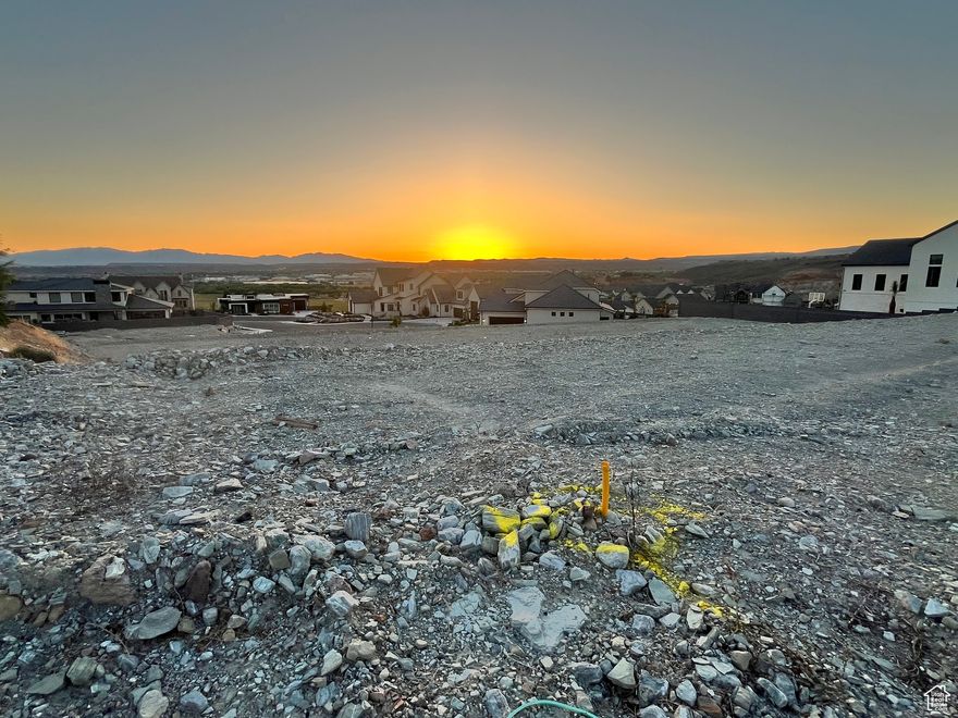 Spectacular views for you to envision and build your dream home on. Imagine enjoying poolside views and entertaining from high up on the hillside. Lot has preliminary grading and utilities are stubbed.  You will be surrounded by beautiful quality homes, Next door is a 2025 Parade of Homes home.  .57 acre lot to accommadate your plans.  Well positioned to provide glorious sunset views across the valley. Survey pins to be found in the front sidewalk so you can measure and plan your dream home layout. Call agent with questions.