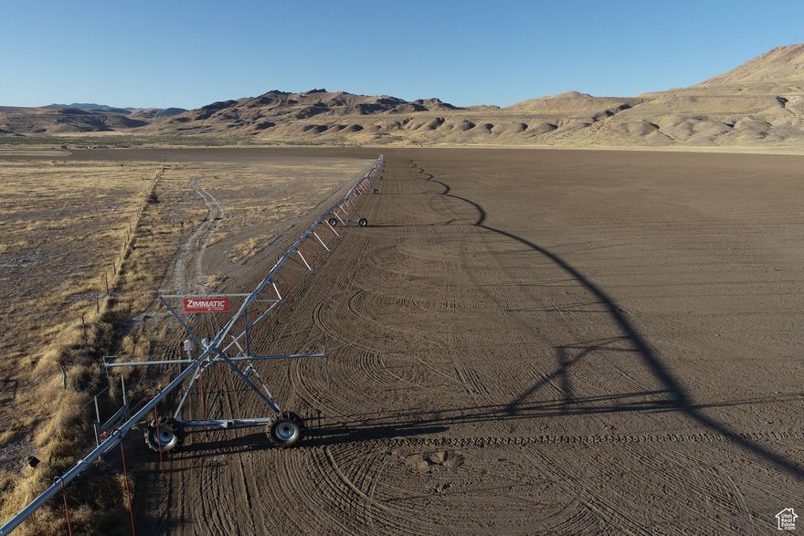 200 ac. farm located in Tooele County. Remote and secluded. 100 ac. into production of barley and fescue. New 7 tower Zimmatic Pivot. 16" irrigation well that is 100' deep with 487-acre ft of water rights. Static water level at 52". The pump is a 40 hp, 650 gpm pump that is driven by a 50 hp electric motor, and that is powered by a 70 kW generator. Seller also has a permit to drill another culinary/livestock well on the other side of the property that has 153-acre ft of water, permit expires in 2030. The pivot irrigation system was installed in September of 2024 and covers 100 acres. Seller is currently in the process of getting the exterior fence 32" net and 2 strands of barb wire and gates up (approximately 1/2 completed). 20' x 15' out building.