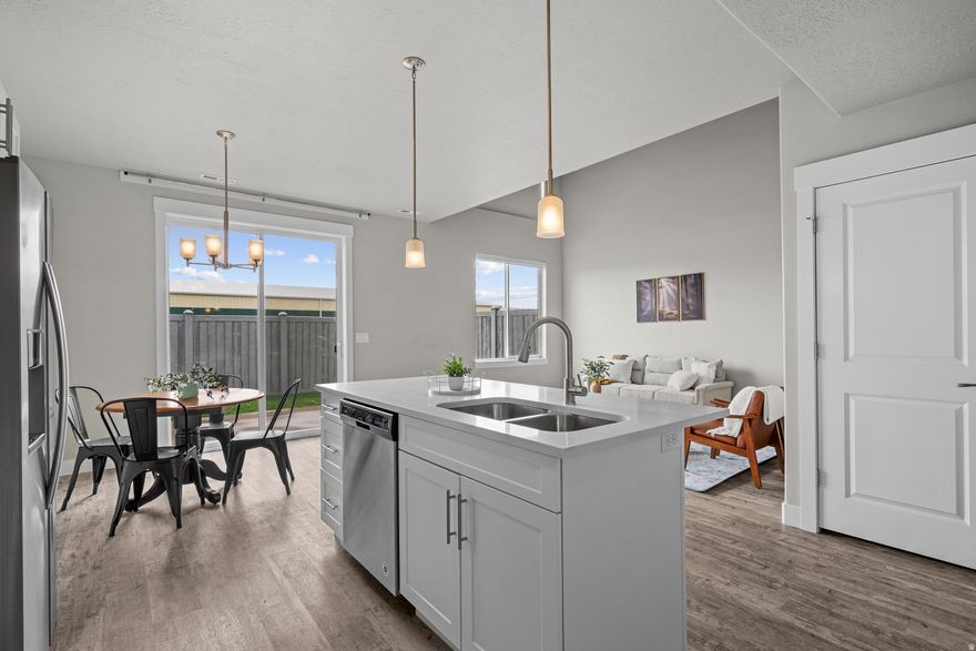 Seller Financing Rate of 4% Possible. Beautifully maintained townhome in the highly sought-after Lakeview Fields community, offering the perfect blend of comfort, convenience, and low-maintenance living. Tucked into a quiet, well kept neighborhood, this light filled home welcomes you with soaring 18-foot vaulted ceilings and an open layout designed for both everyday living and easy entertaining. The spacious kitchen features quartz countertops and ample prep space, seamlessly connecting to the main living areas. The primary suite provides a private retreat with vaulted ceilings, a separate shower and  soaker tub, with a generous walk-in closet. Small yard space maintained by the HOA. Enjoy the ease of HOA living with internet and cable included, along with access to community amenities including a clubhouse, pool, and gym everything you need. Ideally located near shopping, dining, parks, and schools, UVU and BYU, with quick access to major roads and I-15 this home offers both tranquility and convenience in one of the area's most desirable communities.