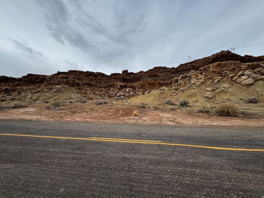 Building lot in Upalco. Featuring beautiful red rock cliffs.  Located on a paved road with culinary water boarding the property.  Acreage figures are provided as a courtesy estimate only. Buyer is advised to obtain an independent measurement.