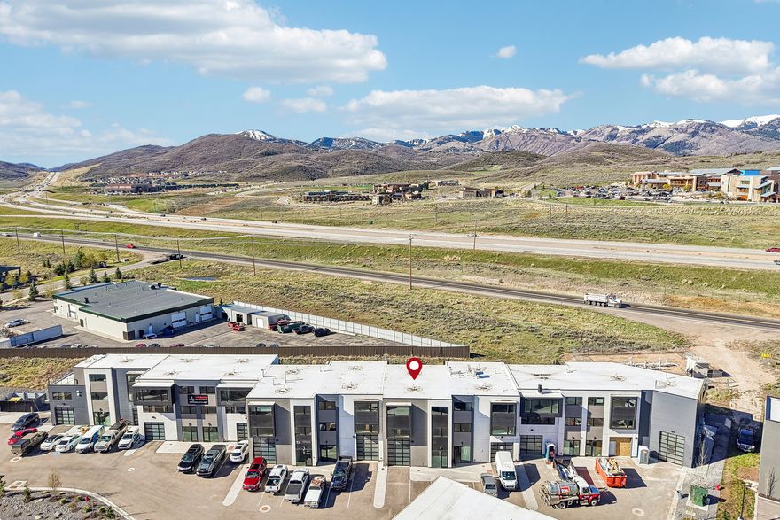 Altitude Lofts represents the pinnacle of Park City flex space, and this to-be-improved unit is the ultimate expression of that vision. Every inch of its ~30'  60' footprint is maximized, fully utilizing the allowed square footage across three levels with designer finishes and premium materials throughout. Sagewood Builders has completed other impressive interior buildouts within the project, and will deliver a finished unit to impress the most discerning buyers. No compromises and no construction headaches, just a turnkey LIVE-WORK-PLAY environment crafted to the highest standard, available for completion within 2026. Situated in the heart of the Forestdale corridor, ideally positioned between I-80 and SR-248 off HWY-40's frontage road, this Service Commercial (SC) zoned property delivers the rare combination of versatility and luxury. In addition, to being one of the larger spaces in the development, it also features an oversized 14' tall garage door and has been granted a Conditional Use Permit (CUP) for an Employee Dwelling Unit (EDU). Building permits are ready- Sagewood Builders can start construction upon your closing!
