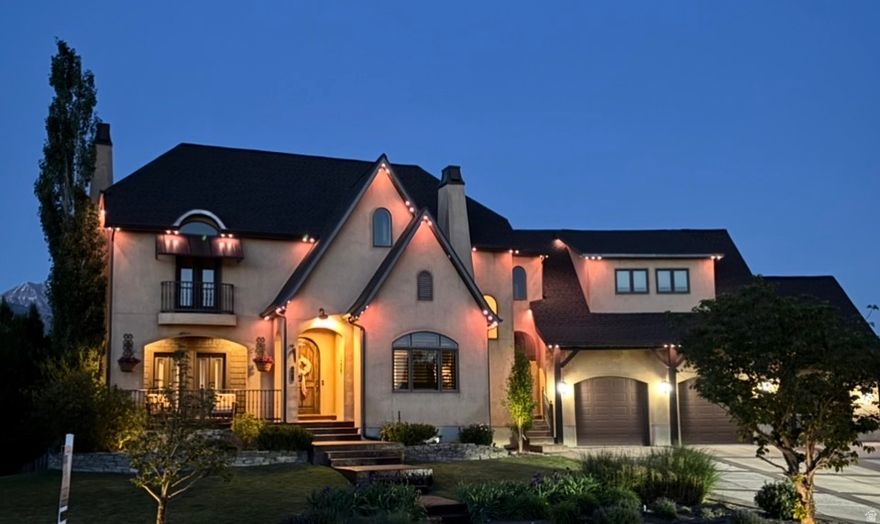**OPEN HOUSE SATURDAY, MAY 16 1:00-2:30 PM** Beautifully updated French Country home is set in a quiet cul-de-sac on a rare 0.35-acre lot, offering a seamless blend of timeless design and modern refinement. Fresh interior paint, new kitchen appliances, and carefully curated lighting enhancements create a sophisticated, cohesive aesthetic throughout.  The second level features three bedrooms and two baths, with a large family room and darling playroom tucked into the eaves. The FULLY FINISHED WALKOUT BASEMENT WITH A SECOND KITCHEN, LAUNDRY, 2 BEDROOMS AND BATH--ideal for a guest suite. Recent capital improvements-including a new roof, newer a/c units, an updated upstairs furnace, and a tankless water heater-underscore the home's exceptional level of care and long-term value. An oversized, extra-height garage offers generous storage and versatility.   The outdoor experience is equally refined, with a spacious deck, exterior fireplace for year-round enjoyment, mature fruit trees, RV parking, and a charming playhouse, creating a setting designed for both enjoyment and effortless entertaining. All while offering effortless access to everyday conveniences, transit, and commuter routes. Call to schedule your personal showing today!   Square footage figures are provided as a courtesy estimate only.