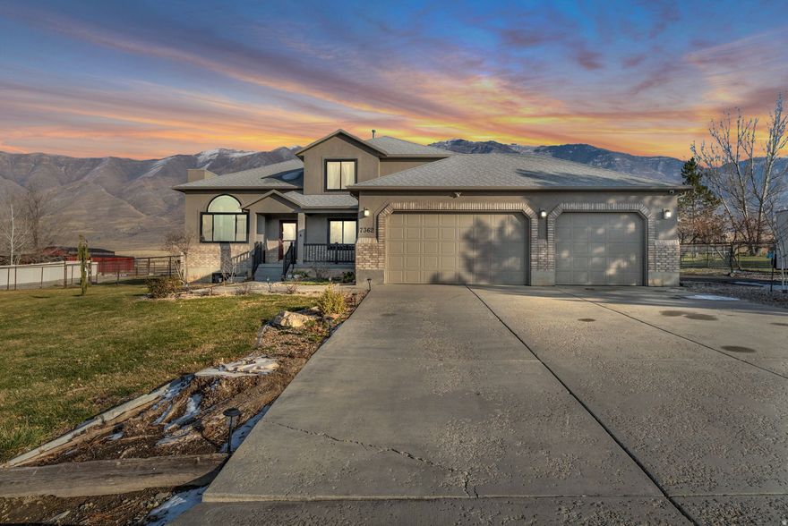 Welcome to 7362 Foothill Dr in Lake Point, Utah-a spacious and versatile property offering the perfect blend of comfort, functionality, and wide-open space. This beautiful 4-bedroom, 3.5-bath home features just over 3,100 square feet of living space spread across three thoughtfully designed levels, providing room to grow and adapt to your lifestyle.Recent updates include newly replaced triple-pane windows and a freshly painted exterior, adding both efficiency and curb appeal. A bedroom on the main level offers added convenience, while the walkout basement fills the home with natural light and provides excellent flexibility for entertaining, multi-generational living, or future customization.Situated on a full acre of land, this fully fenced property is ready for your pets and livestock and offers zoning that allows for barns, oversized garages, and additional outbuildings. In addition to the attached 3-car garage, a detached single-car garage provides extra space for vehicles, equipment, or hobbies. With plenty of room to expand, garden, or create your dream outdoor setup, this property offers endless possibilities.Enjoy the peace and privacy of country-style living while remaining conveniently close to town amenities. This is a rare opportunity to own a spacious home with land, flexibility, and potential-inside and out.