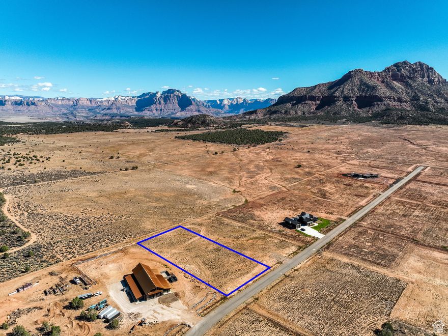 Build your dream home on this 1.96-acre lot in Apple Valley's Wells Estates. Featuring wide-open vistas of Zion National Park and Southern Utah's famous red cliffs, this parcel combines natural beauty with the convenience of paved roads and easy access.