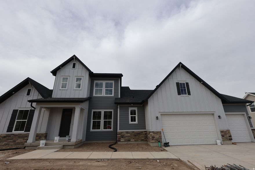 The Rivershore in Brixton Park has been a striking home plan that is breathtaking from the outside.  This home features a main floor primary bedroom, and incredible entertaining space from a dining room that can accommodate a 12 setting table, to an extra large living room with a cozy fireplace. The primary bathroom is designed with a gigantic walk-in shower, and a closet fit for his and hers' dreams.  Upstairs are large secondary bedrooms and an unfinished basement that has space for 2 more bedrooms, a gym/media room and great storage space!  9ft ceiling on all 3 floors and a homesite that does not have a backyard neighbor and preserves views of Mt. Timpanogos and the nearby Temple. Home estimated to be complete in May 2026.  Preferred Lender financing incentives available, call agent for more details.