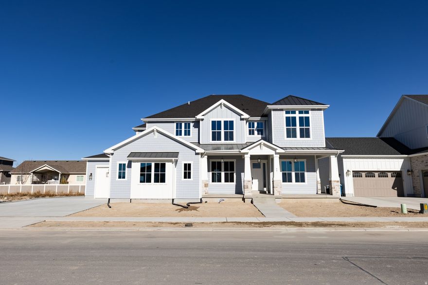 Welcome to Holdaway Fields-one of Vineyard's most desirable neighborhoods. This home was built for connection, featuring four spacious bedrooms, a huge kitchen, and multiple living areas including a great room, den, and family room-perfect for entertaining and everyday living. The master bedroom boasts tray ceilings and a relaxing retreat feel. High, expansive windows and a stunning floor-to-ceiling fireplace create a bright, open, and unforgettable living space with stunning mountain views.