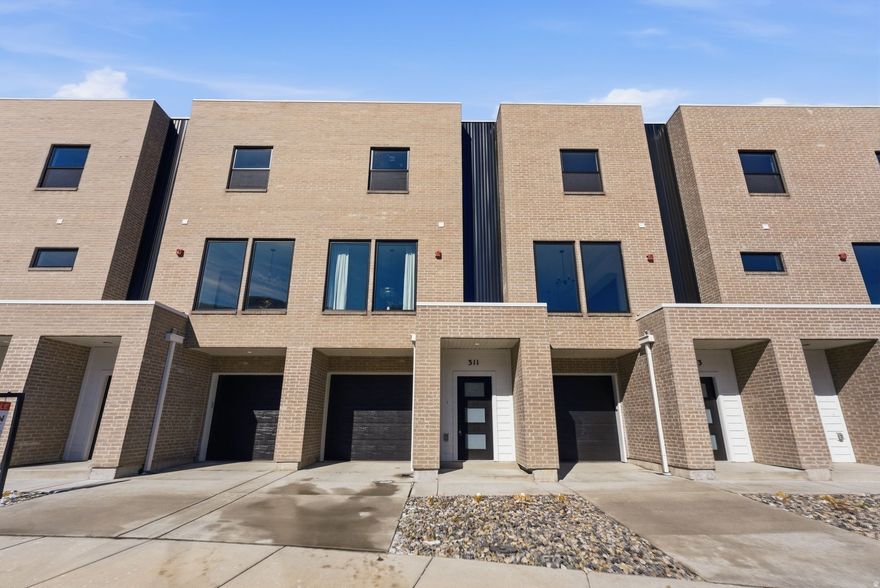 Last few new construction units remaining. Step into this thoughtfully designed 3-bedroom, 3.5-bath townhouse offering breathtaking views of the Salt Lake Valley and modern-day comfort throughout. Large windows invite abundant natural light into the home, enhancing the open and airy feel of each space. The kitchen connects effortlessly to the main living and dining areas, creating an ideal layout for both relaxed daily living and hosting gatherings.   The property includes a one-car garage plus an additional driveway parking spot for added convenience. The spacious primary suite serves as a private retreat, featuring its own en-suite bath and generous closet space. Two additional bedrooms, each with access to full bathrooms, offer flexibility for guests, family members, or a dedicated home office.  Located just moments from outdoor adventures, shopping centers, restaurants, and easy freeway access, this home delivers comfort, quality, and convenience in one of the valley's desirable areas. Enjoy stylish living with scenic surroundings in this exceptional Salt Lake Valley townhouse.