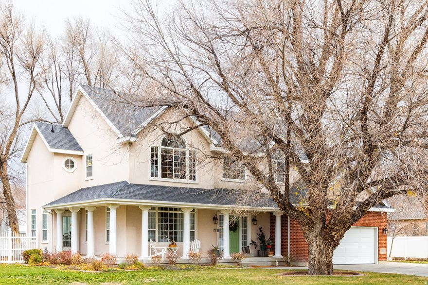 First time on the market, this lovingly maintained custom home sits on over half an acre in the heart of Draper's desirable east bench. A fully fenced yard with mature trees creates a private, park-like setting, while the inviting wraparound front porch offers a warm welcome. Inside, the open family room and kitchen serve as the heart of the home, featuring expansive windows that fill the space with natural light and a cozy fireplace that adds warmth and charm. The spacious primary suite includes a walk-in closet, and picture windows throughout provide light and comfort from every angle. An unfinished basement offers endless potential for future expansion and customization. The oversized three-car garage provides ample room for vehicles, storage, and parking. Ideally located near hiking and running trails, just minutes from Cottonwood Canyons and the Corner Canyon mountain biking trail system and park, and within the highly sought-after Corner Canyon High School boundaries, this home perfectly blends space, comfort, and an exceptional outdoor lifestyle. Seller would prefer 24 hour notice on showings.