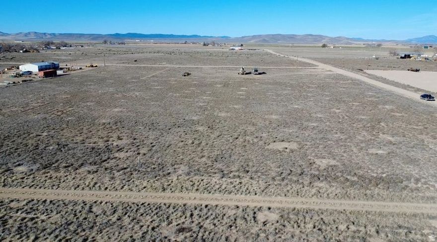 0.50 acre, flat and ready to build, lot in Beryl Junction with a well to be installed prior to closing and a well share agreement with the parcel to the north. Includes 0.5 Acre Foot of Water Right #71-6066 (Priority Date 12/27/1956). Dixie Power is located just 200 feet away on 300 East. Excellent Highway 18 access with easy year-round access. Ideal for a primary residence, second home, cabin, or weekend retreat. Bring your RVs, trailers, and toys. Great opportunity to build now or buy and hold as water-backed land continues to grow in value. Located 15 minutes to Enterprise for groceries, gas, schools, dining, and medical, and about 50 minutes to St. George or Cedar City. Close to reservoirs for boating and fishing. Explore all of the nearby mountain trails with your off road vehicles.