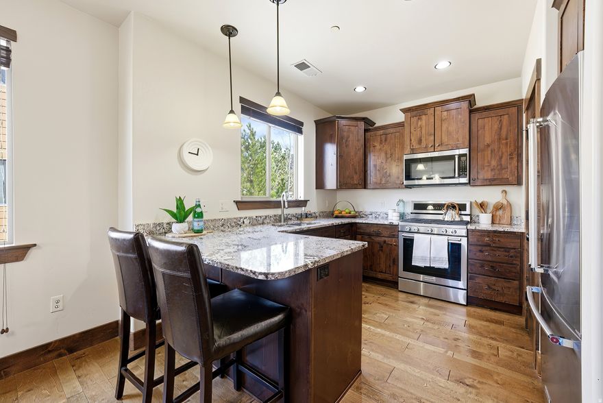 View 3D Tour-Welcome to Black Rock Ridge-where mountain living meets exceptional investment potential. This top-floor, corner-unit condo offers three bedrooms and two bathrooms and comes tastefully furnished with thoughtfully selected pieces, making it completely turnkey and ready for immediate enjoyment. Whether you're seeking a personal retreat, a second home, or a short-term rental opportunity, this property offers outstanding flexibility. The open-concept floor plan is designed for both relaxing and entertaining. The updated kitchen features stainless steel appliances and flows seamlessly into the main living space, where vaulted ceilings and a cozy gas fireplace create the perfect gathering place after a day of outdoor adventure. Every detail has been carefully curated so you or your guests can arrive and begin enjoying the home right away. Located in the desirable Black Rock Ridge community, this condo places you just minutes from Park City Mountain Resort, Deer Valley's new East Village, and Historic Main Street with its renowned dining, shopping, and entertainment. Outdoor recreation at Jordanelle Reservoir and convenient access to Salt Lake City International Airport make this an ideal base for experiencing the Park City lifestyle year-round. Don't miss this rare opportunity to own a turnkey mountain property that offers both lifestyle and income potential.