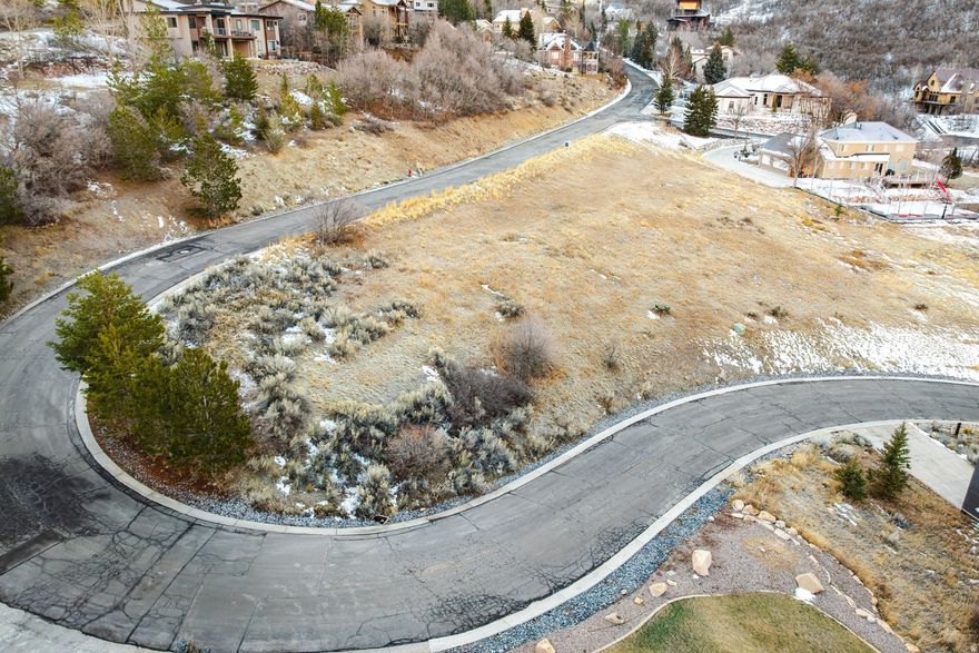 Discover the rare blend of seclusion and accessibility on this stunning 0.66-acre parcel in Emigration Canyon. Surrounded by natural beauty and abundant wildlife, the property offers immediate access to hiking, biking, and year-round outdoor recreation, all just minutes from downtown Salt Lake City. Picturesque canyon views and a peaceful setting create an ideal backdrop for a custom residence that balances nature with modern convenience. The lot features a gradual sloped, buildable envelope, simplifying the construction process and reducing time and cost compared to more hilly terrain. Set among established custom homes, the property is well prepared for development, with architectural plans, an approved percolation test, a fully designed septic system, and a completed slope stability analysis already in place. A truly turnkey opportunity to build in one of Salt Lake City's most sought-after canyon locations.