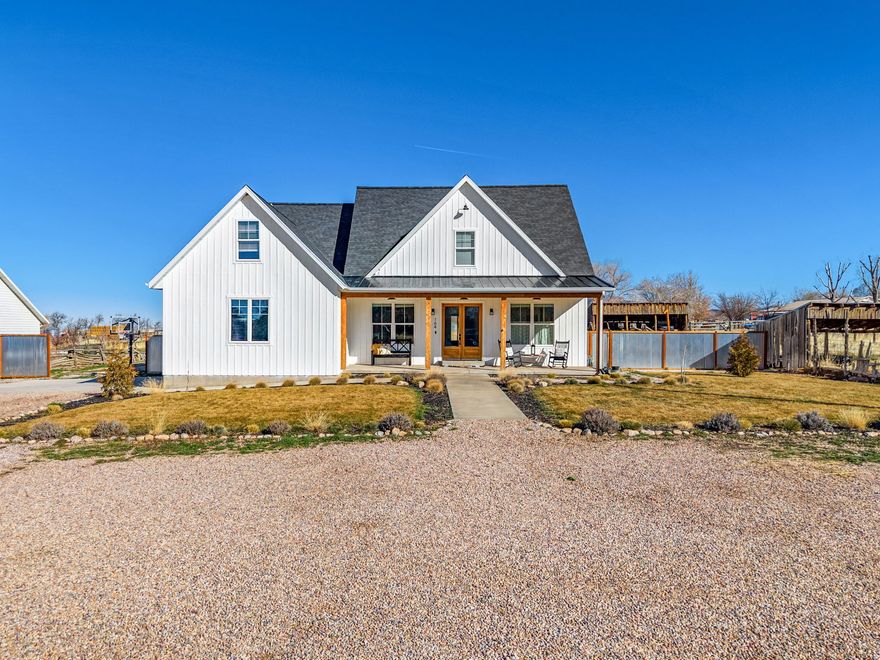 This beautifully finished custom home offers three levels of expansive living space, perfectly designed for gathering family and friends. The main-level primary suite is a true retreat, featuring a separate tub & shower, plus a walk-in closet with its own dedicated laundry area.  The upper level has 3 bedrooms, a family room, a full bath, and a second laundry room for ultimate convenience. The fully finished basement adds even more value with a large family room, 2 additional bedrooms, and a full bath. High-end upgrades throughout include marble, quartz, and granite countertops, hardwood flooring, a cozy gas fireplace, and vaulted ceilings. Outside, the fully landscaped yard features a basketball/pickleball court & hoop, 2 story playhouse, fire pit, garden & orchard area and ample room for future sheds or "toy" parking. Watch the stunning sunsets from your back deck. Front porch faces south for the perfect shady summer retreat or to catch the warm winter sun.