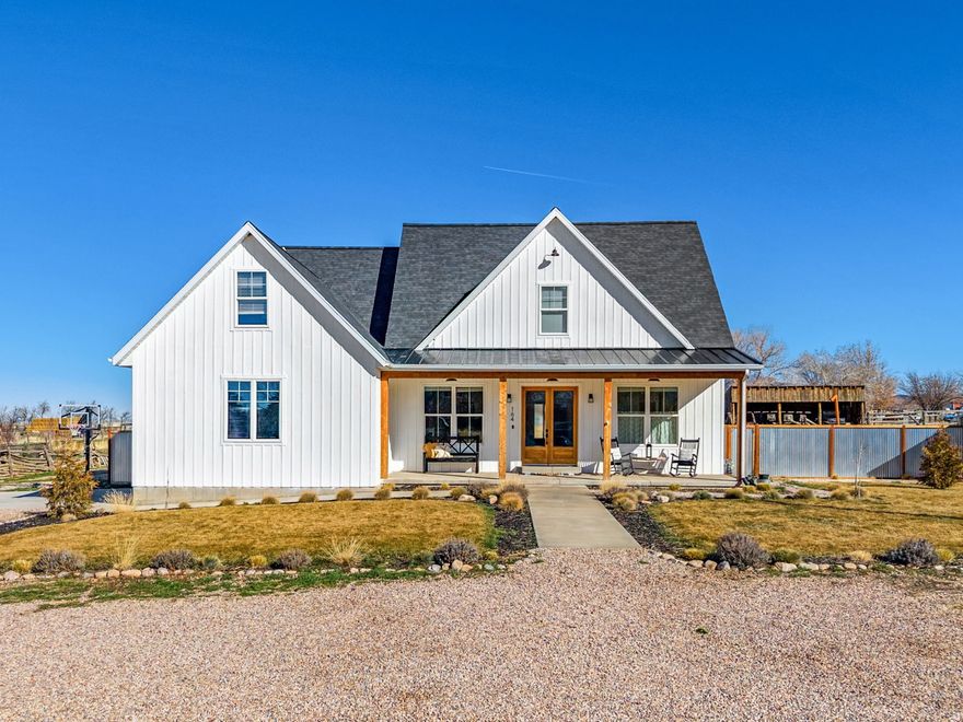 This beautifully finished custom home offers three levels of expansive living space, perfectly designed for gathering family and friends. The main-level primary suite is a true retreat, featuring a separate tub & shower, plus a walk-in closet with its own dedicated laundry area.  The upper level has 3 bedrooms, a family room, a full bath, and a second laundry room for ultimate convenience. The fully finished basement adds even more value with a large family room, 2 additional bedrooms, and a full bath. High-end upgrades throughout include marble, quartz, and granite countertops, hardwood flooring, a cozy gas fireplace, and vaulted ceilings. Outside, the fully landscaped yard features a basketball/pickleball court & hoop, 2 story playhouse, fire pit, garden & orchard area and ample room for future sheds or "toy" parking. Watch the stunning sunsets from your back deck. Front porch faces south for the perfect shady summer retreat or to catch the warm winter sun.