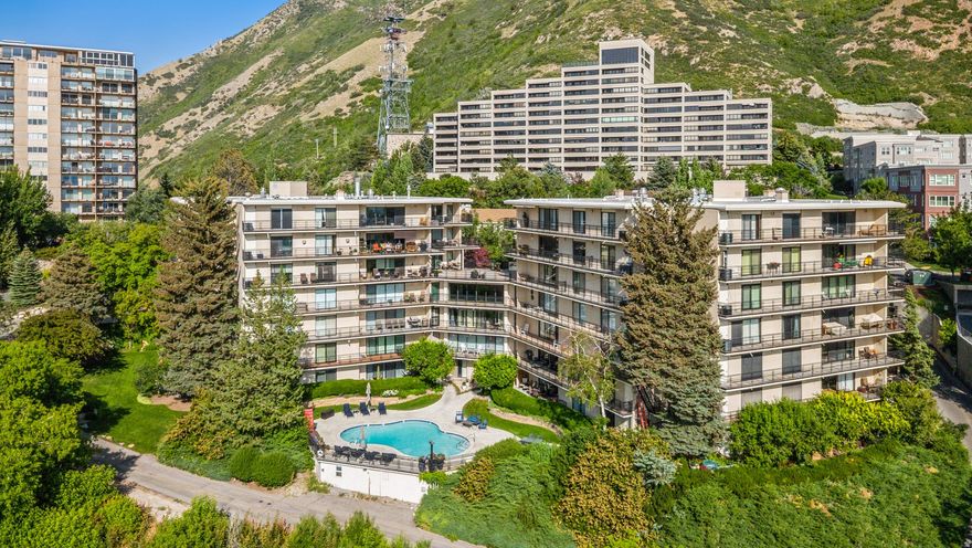 This is a rare opportunity to live above the city, surrounded by sweeping, breathtaking views. The open floor plan offers generous space for entertaining, and every detail reflects a designer's touch. Step outside to hike the Shoreline Trail, bike Emigration Canyon, or enjoy a peaceful stroll through the nearby park. At night, you might even hear the lions roar from Hogle Zoo-a reminder that nature is close. It feels like mountain living, yet downtown Salt Lake City is just 15 minutes away. Nestled in one of the city's most coveted communities, this home blends serenity, style, and convenience.