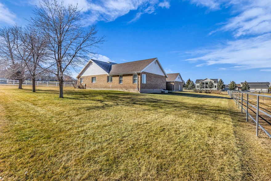 *Be sure to check out the virtual tour & floor plans!* Discover this rare custom all-brick home on over 2 acres of premium horse property in picturesque Mapleton, UT! South-facing with breathtaking Wasatch Mountain views, featuring a large barn, stables, tack room, and corrals. Main-level living with spacious light-filled rooms, formal & informal dining, generous bedrooms, oversized 3-car garage with bonus upper room (game room potential), and expansive garden-perfect for horses and family in a peaceful, trail-rich community! 3.8 shares of Strawberry Water will transfer with a warranty deed. Buyer and Buyers agent to verify all information.
