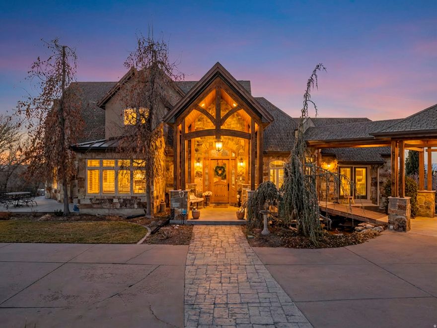 Mohogany Ridge  0.96-acre estate lot  3 distinct living areas with ADU  Walkout basement separate entrance  Heated pool and hot tub  Lake, valley and mountain views  Owned solar  Set on nearly an acre in Mohogany Ridge, 861 N 1100 E in Pleasant Grove offers panoramic lake, valley, and mountain views and a rare level of flexibility with three distinct living areas, including an ADU and a separate-entrance walkout basement. Natural light fills the open main-level living spaces through expansive windows, anchored by a vaulted great room with wood-beam ceiling. The chef's kitchen highlights custom knotty alder cabinetry, High Maxx countertops, and premium appliances including Sub-Zero refrigeration and Wolf gas cooking, plus wall oven, warming oven, microwave, and dishwasher. With three kitchens plus a kitchenette, a sun room with water hookups and drain, and a main-floor office or additional bedroom, the layout supports privacy and ease across the home.  Outside, enjoy a resort-style setting with a saltwater pool, hot tub, pergola-covered patio, BBQ hookups, and multiple decks for dining and entertaining, complemented by a koi pond and waterfall. Well-maintained with a timeless footprint ready for your design vision, this home pairs enduring craftsmanship with room to personalize. Additional highlights include Milgard windows, central vacuum, intercom, soft water, four furnaces, central air, two water heaters, and hot and cold water spigots in the garage. Accessibility features include 36-inch doors and wide hallways. Three lots are included to create the 0.96-acre parcel. Tax ID 46-561-0001(.59 acres) Tax ID 40-062-0016 (0.15 acres) and Tax ID 40-062-0012  (0.22 acres) . Square footage is from an older appraisal and is provided as a courtesy; buyer to verify.