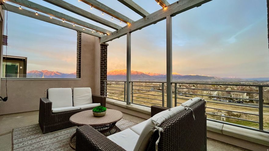 One of the best view townhomes in Daybreak. Elevated above open park space with unobstructed Wasatch and Oquirrh views from all three levels. This thoughtfully maintained home is filled with natural light and offers a layout that blends comfort, function, and lifestyle. The main living area flows easily into the kitchen, creating an ideal space for both everyday living and entertaining. A standout feature is the top-level bonus living space, complete with a fireplace, wet bar, small office nook, and access to two private decks. From this level, you can take in sweeping views of both the Wasatch Front and Oquirrh Mountains, creating a truly special space for relaxing, hosting, or working from home. The lower-level flex space offers even more versatility and is perfect for a home office, gym, theater room, or additional living area. Beyond the home itself, you are just a short walk from Oquirrh Lake, waterfront trails, dining, boutiques, concerts, pools, and community amenities that make Daybreak one of Utah's most desirable communities.