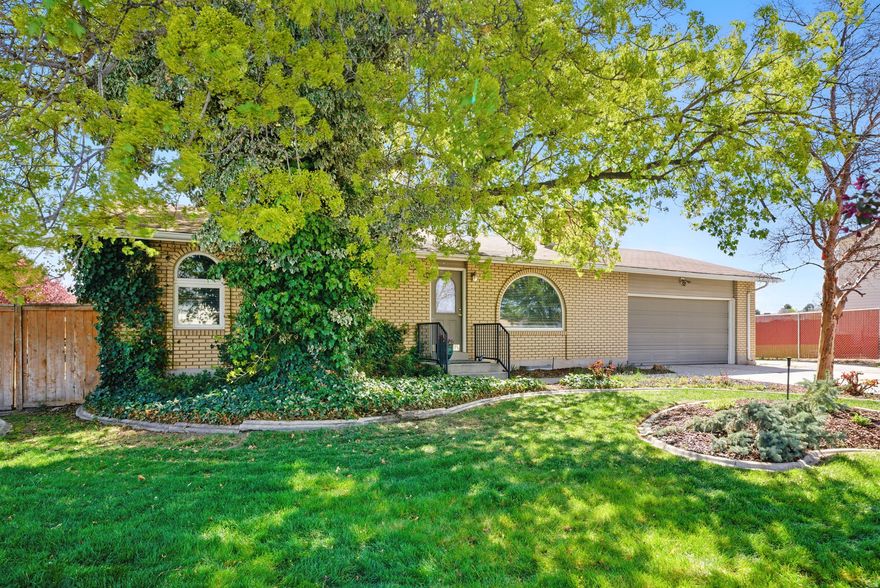 Don't miss this amazing price improvement! This is truly the deal of a lifetime. An unbeatable opportunity you won't find again!! Welcome to this charming all-brick mid-century gem in a peaceful West Valley City neighborhood! Built in 1973, this home has been lovingly maintained and thoughtfully updated over the years. The main floor features a beautifully renovated kitchen with a massive island, perfect for meal prep, gatherings, and everyday life. A built-in desk adds function, while arched windows and doorways bring character and charm. Just off the entry, you'll find a formal dining room that could easily be converted into a home office or an additional bedroom, with a cozy living room and fireplace on the opposite side. Also on the main level you will find two bedrooms, including a spacious primary suite with direct access to the hall bath, and tile flooring that adds style and practicality. The finished basement includes a large family room with custom cabinetry, plenty of space for both TV lounging and game nights. There's an additional bedroom and a beautifully renovated bathroom, plus tons of storage for food, supplies, and more. Outside, the backyard is like a fairyland: lush gardens, three decks, and even a hidden play area tucked in the bushes. The rebuilt main deck is in excellent shape, and the space is magical in the summer months. The oversized two-car garage is uniquely deep, and the RV pad and long driveway offer even more flexibility for vehicles and toys. With roof technology extending the life of the shingles and thoughtful updates throughout, this home blends timeless charm with everyday functionality. Come see why this West Valley City gem stands out!