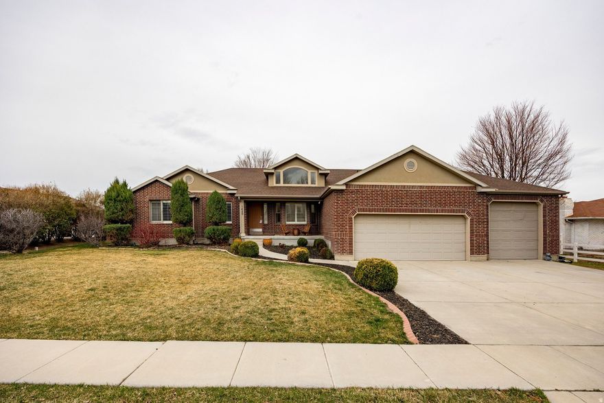 Situated on a rare 0.50-acre lot in South Jordan, this exceptional property offers space, versatility, and amenities that are hard to find. The backyard features a full tennis court that also meets basketball standards, creating the perfect space for recreation and entertaining. Inside, the home offers five bedrooms and 3 bathrooms with a wonderful open floor plan designed for comfortable main-level living. The main floor includes a formal living room, while the open great room just off the kitchen features a cozy gas fireplace, creating a warm and inviting gathering space. The spacious layout provides abundant natural light and seamless flow between the living, dining, and kitchen areas. The home also features a wonderful primary suite with an updated bath, providing a comfortable and private retreat. The fully finished lower level includes a private mother-in-law apartment complete with its own full kitchen and separate entrance, ideal for extended family, guests, or potential rental income. Additional highlights include a three-car garage and property zoning that allows for a horse or other livestock, giving you the rare opportunity to enjoy country-style living while still being close to city conveniences. A unique blend of space, functionality, and recreation-this South Jordan property is truly one of a kind.