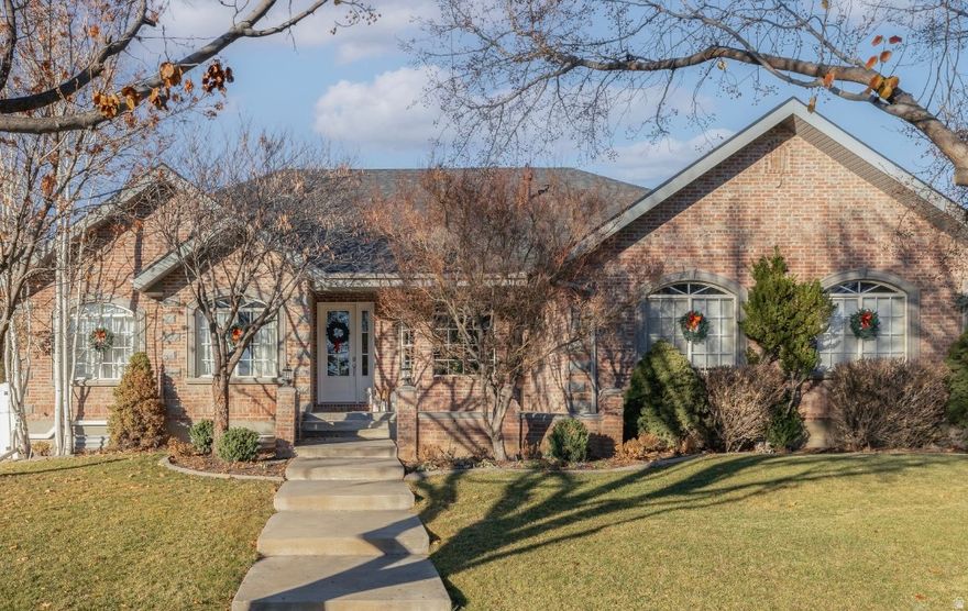 Cottage charm meets modern living in this thoughtfully renovated timeless brick home filled with warmth and character. High-end built-in appliances, signature hardware fixtures, designer lighting, and natural stone and marble surfaces create a timeless, inviting feel throughout. No area was left untouched.  The kitchen was opened to improve flow and light. It features built-in Dacor appliances, an Italian Ilve range and a furniture piece bakers island. Expansive mountain views from the kitchen and family room are truly unmatched. A well-designed butler's pantry offers generous built-in storage and an additional sink for ease of use. Even the laundry room offers that English cottage charm.  Every bathroom has been renovated to the studs, with all finishes thoughtfully reimagined. Custom millwork and cottage-style details add craftsmanship rarely found have been highlighted. A surround sound system is integrated throughout the main floor, along with central vac.  Upstairs are two-bedroom suites with walk-in closets and a shared bathroom. The landing includes a charming built-in bookshelf ideal for toys, books, and games. The lower level offers an expansive rec room with new carpet, LVP, paint and cabinetry. Plus a separate gaming or playroom that may be used as-is or converted into an additional bedroom or studio.  A separate portion of the basement includes a private two-bedroom apartment with its own entrance, dedicated heating and cooling system, added insulation, and current rental income of $1,700 per month. It's the perfect place for visiting guests, rental income, or for multi generational living.  Outdoor living includes a large covered deck and patio. The property also features a rare 1,152 sq ft detached garage and shop in addition to the attached 664sqft garage. The detached garage is suitable for boats or a small RV storage, along with an RV electrical hookup on the side of the home. The owners use the cement area for pickleball, basketball and for workouts. Recent upgrades include a new roof (Nov 2024), new drainage and gutter systems (2025), updated HVAC and heaters (2018 & 2025), added insulation (2024) instant recirculating hot water, water softener, new sprinklers, improved drainage, and fresh landscaping. The yard offers ample space for future expansion, a pool, or pool house can easily be accommodated on this large property.  Home is where the heart is-and this home is ready to be called your own.
