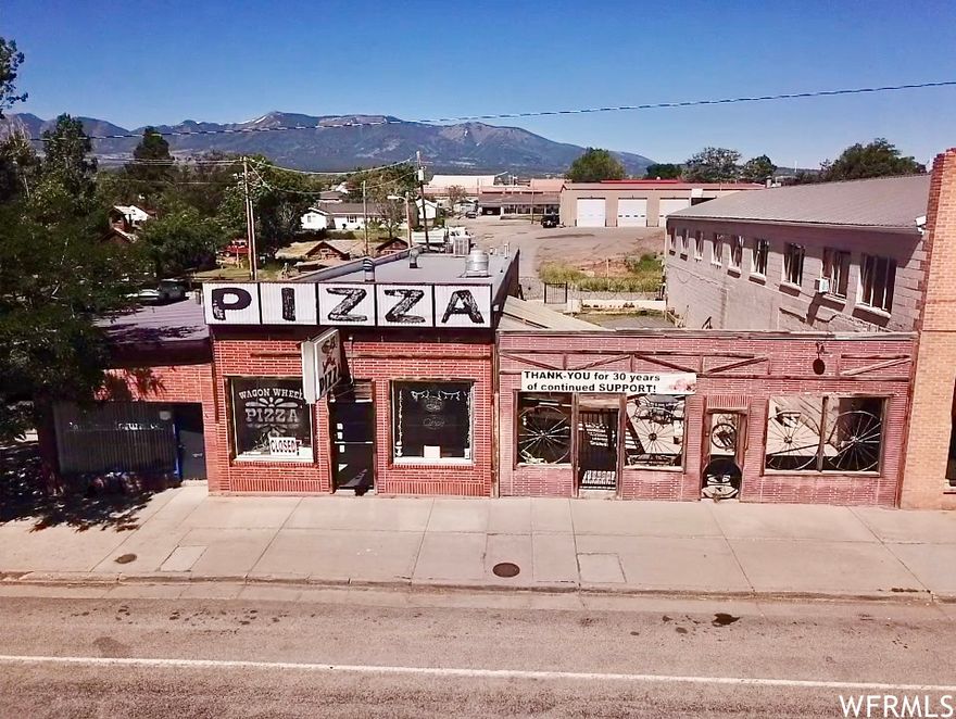 This commercial building is prime real estate along main street, offering excellent visibility and accessibility to locals and tourists visiting the 3 National Parks nearby. It is the original building and has been very well maintained throughout the years. Included on the property is an outdoor area, providing endless possibilities for outdoor dining, hosting events, or even building another commercial space with living quarters above. Don't miss out on this prime real estate to fulfill your business passions!