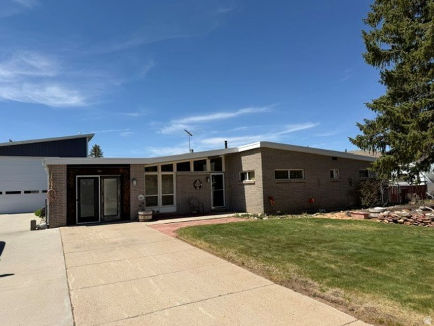 Experience elevated mountain living in this beautifully renovated Dutch John retreat, ideally located in the heart of the legendary Flaming Gorge Recreation Area. Thoughtfully redesigned with a modern open-concept floor plan, this exceptional home blends comfort, functionality, and adventure-driven lifestyle appeal. The spacious maple kitchen has been extensively updated and flows seamlessly into an expansive great room-perfect for entertaining after a day on the water or river. Two stylishly remodeled full bathrooms, upgraded HVAC system, and quality improvements throughout make this property truly move-in ready. A standout feature is the impressive 37' x 25' deluxe RV garage complete with a 14-foot door and lofted storage-ideal for boats, RVs, drift boats, side-by-sides, and all your outdoor recreation gear. Step outside to enjoy a private backyard oasis featuring a covered deck with removable enclosure panels for year-round enjoyment, an additional covered patio, mature garden areas, and breathtaking sunset views across the surrounding landscape. Located just minutes from the world-famous Green River and the pristine waters of Flaming Gorge Reservoir, this rare property offers the perfect combination of luxury, recreation, and investment potential in one of Utah's premier outdoor destinations. All information is deemed reliable but is not guaranteed and should be independently verified.