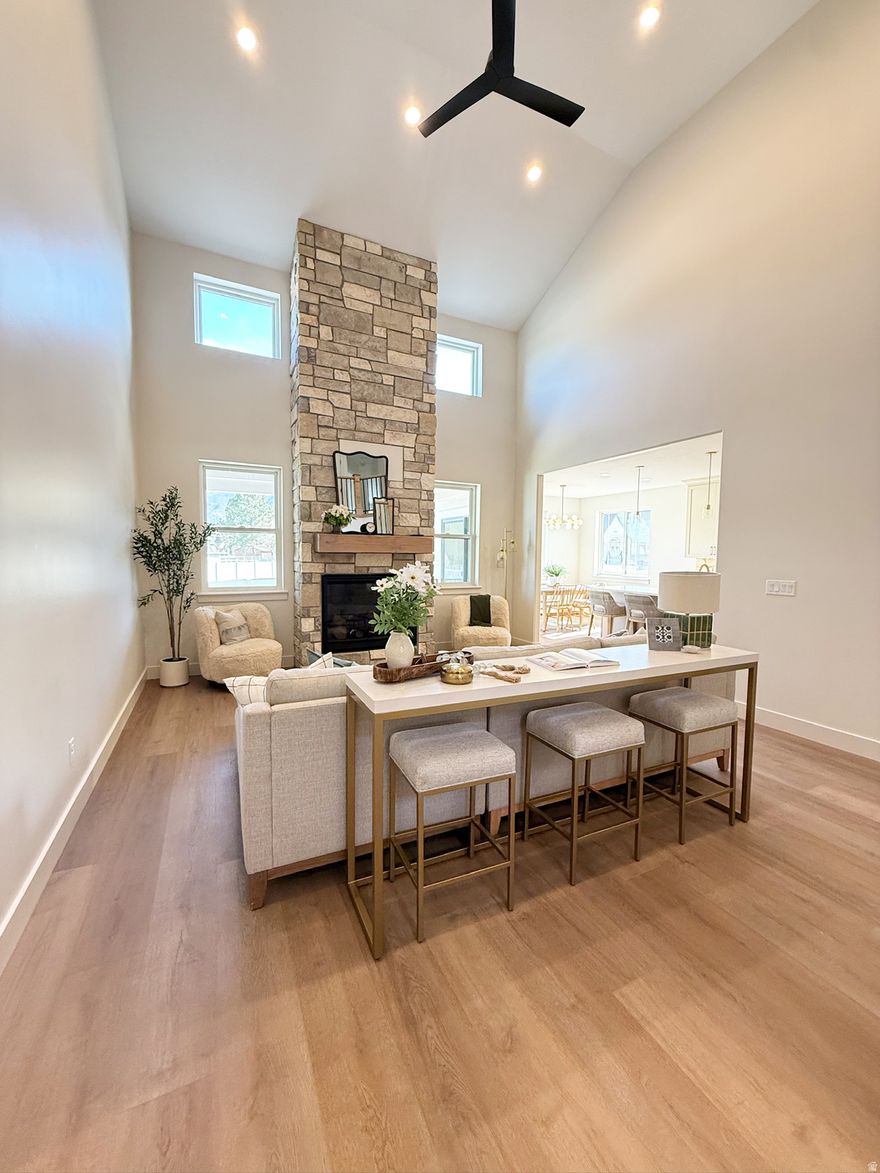 Stunning brand-new two-story home located in a desirable South Weber neighborhood. This thoughtfully designed home features a spacious primary suite on the main level, with three additional bedrooms upstairs. The fully finished basement is set up as a mother-in-law apartment with a separate entrance, offering great flexibility and potential for additional income. Modern finishes, functional layout, and quality construction throughout make this home a must-see!