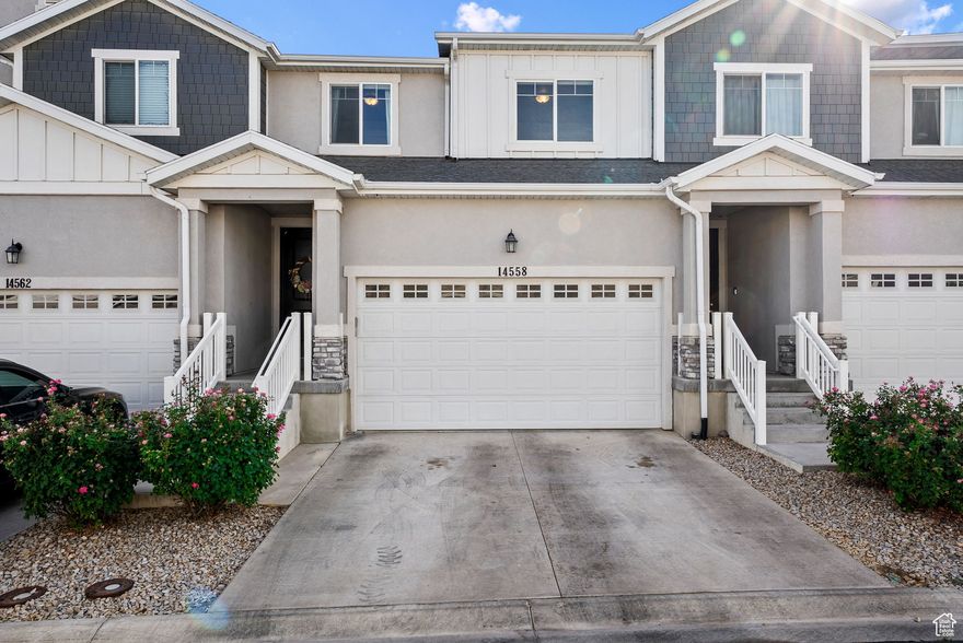 ASSUMABLE MORTGAGE LOAN WITH PERMANENT RATE OF 3.375% AVAILABLE TO NEW QUALIFIED BUYER. $2000 carpet allowance available. FHA approved community. Home could also be used as a rental if desired. This home differs from others in the area due to its significantly lower HOA re-investment fee. It has been updated throughout with higher end finishes and appliances.  Beginning with the stainless-steel appliances including a gas range/oven, fridge with 2 ice makers and the washer & dryer with a steaming function. Custom finished laundry area, tankless water heater for on demand hot water, smart thermostat and smart garage door opener, double sinks in the primary ensuite, walk in closet, quartz counter tops, shiplap accent walls, new split shade window coverings (blackout in the bedrooms, sheer on main level), oversized ceiling fans, new contemporary pendant and dining room lighting and electric vehicle charging outlet in the garage. The basement has potential for a bedroom, family room and full bathroom; plus additional storage space. Now that we have covered the home itself, lets not forget that there is a list of community amenities as well including a swimming pool, gym, clubhouse, park/playground for the kids, snow removal in the winter and no maintenance yard the rest of the year. All of this for only $132 a month HOA fee.