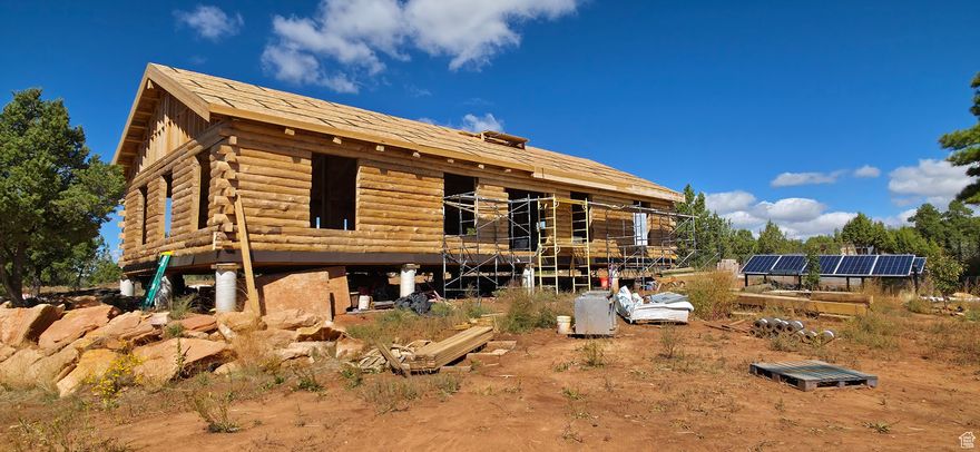 Located near Four-Corners of Southeastern Utah, two log cabins off-grid year-round living retreat. A grand year-round potential retreat and possible income opportunity with this location and close proximity to Moab, four corners, national parks; mountains, canyons, and desert hikes; mountain biking, horse rides, and ATV trails; seasonal hunting, a local ?shing lake, and mountain foraging. Pristine Blue Mtn and Devils Canyon Rim views off your new cabin deck. Built for immediate use is a small furnished 1150 sq ft cabin equipped with all necessary amenities. Then, you'll soon upgrade and subsequently move into your 2,100 sq ft cabin, located above grade level, overlooking the canyon from a 12' bi-folding back door. Two dried in small 16 x 16 guest cabins will be built next to the Canyon Rim. The property is powered by 10-500W Panels connected to Full-River 400AH Batteries, a Flexmax 80A CC, and a 3000W 80A 24/48V Charger/Inverter. A 20k Cummins Home Standby generator provides backup power, but with approximate 300 days of sunshine, it is barely needed.  One large septic tank has been installed, complete with baed leach lines measuring 240 yards. The recently drilled well on the land provides approximately 2.5 gallons of water per minute to a 1200-gallon cistern. There are eight above-ground irrigated garden boxes, ve fruit trees (two dwarf apples, two plums, and one cherry tree). Included interior building items to be installed by buyer include: vintage cottage solid wood kitchen cabinets, three wood burning stoves, one gas corner replace, cast iron tub, Kohler soaker tub, cast iron sink, 2200 sq ft of vinyl planking ooring, all water piping and drainpipe, and Romex wiring for cabin. Heated Chicken Coop is a 10x20 stick-framed structure on a concrete slab with split sides for ducks and chickens. Land backs up to the BLM canyon rim for immediate access to hiking, off-roading, climbing, or just enjoying the desert scenery.  The land features Anasazi Ruins and contains multiple sites with arrowheads, tomahawks, and pottery. Canyon offers pueblos built on the sides of the cliffs. Buyers to verify all information, square footage, and acreage. This retreat is a truly pristine opportunity, nestled in a perfect setting.