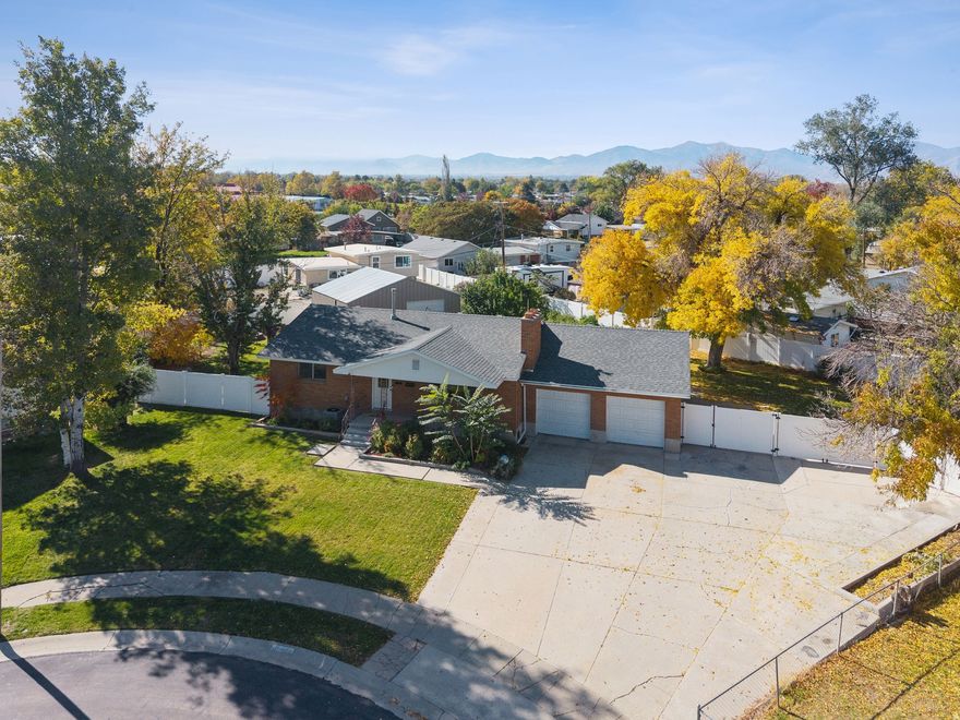 Mountain Views, Rental Potential, and Room to Roam in West Valley City. Welcome to your future oasis on a sprawling .37-acre lot in the heart of West Valley City! This spacious 4-bedroom, 2-bathroom home boasts over 2,500 square feet of comfortable living space and offers the rare opportunity of a legal basement ADU - complete with its own private entrance and a full kitchen. Whether you're looking to generate extra rental income or need a flexible space for extended family, this home checks every box. Upstairs, you'll find an open layout perfect for entertaining, with large windows that frame stunning mountain views. Step outside and enjoy the hot tub, harvest from your own fruit trees and veggie garden, or unwind under the stars. The 25x40 detached shop is a dream for hobbyists, storage, or even a home-based business. Tucked in a quiet neighborhood with easy access to all of Salt Lake County, this property offers the best of both worlds: peaceful suburban living and prime location convenience. Square footage figures are provided as a courtesy estimate only and were obtained from county. Buyer is advised to obtain an independent measurement.