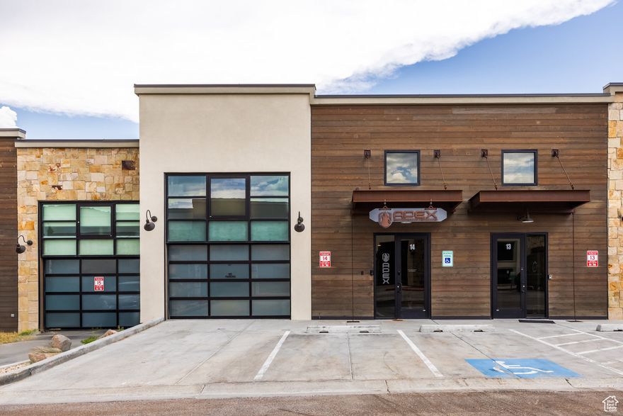 Welcome to a Rare Opportunity in Park City's Park East II & III Business Community. This versatile, modern mixed-use property offers the ultimate ''live, work, play'' lifestyle across 4,600 square feet and three thoughtfully designed levels. Zoned for light industrial use, it accommodates a wide range of commercial and residential possibilities. The main level features an expansive commercial space with soaring ceilings, a full bathroom, gas heat, 3-phase power, and a spacious 3-car garage with potential for a 4th car or side-by-side. It's an ideal setup for a showroom, workshop, or creative studio. The lower level provides additional office, commercial, or storage space, offering even more flexibility for your business or operational needs. Upstairs, a fully approved ADU (Accessory Dwelling Unit) delivers a sleek studio-style apartment, complete with a full kitchen, open-concept living and sleeping area, and a full bathroom-perfect for a live-in owner, executive suite, or rental income. The property showcases custom steelwork throughout, blending modern aesthetics with structural integrity. Notably, the space has not been overbuilt, preserving the freedom for a new owner to further customize or expand to suit evolving needs-be it additional business use, creative development, or residential enhancement. Additional highlights include two assigned parking spaces and a private rooftop deck with hot tub-an exceptional amenity for entertaining or relaxing. Centrally located just minutes from Park City's historic Main Street, with convenient access to Highway 40 and Salt Lake City International Airport, this one-of-a-kind property seamlessly blends prime location, cutting-edge design, and limitless multi-use potential.