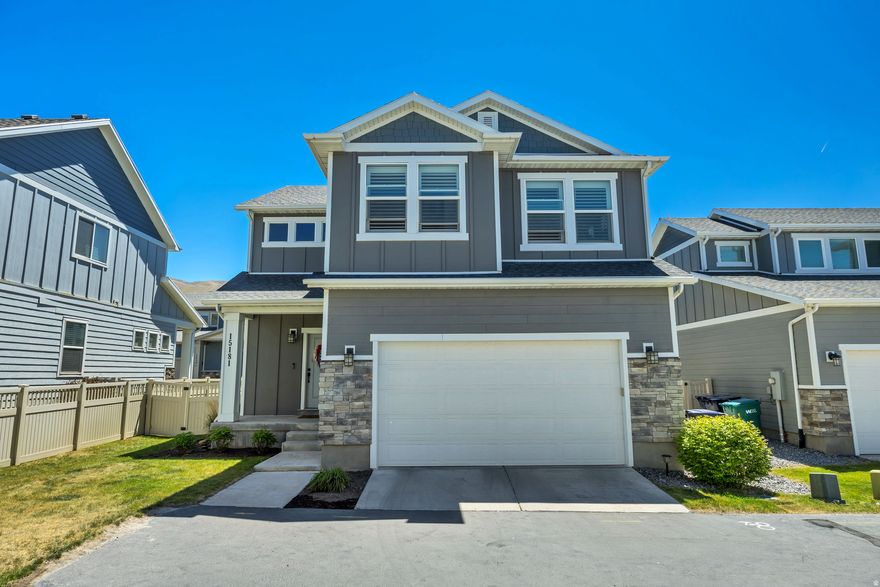 The home features a bright, open layout that's great for everyday living and entertaining, with white cabinets and a contrasting island, open shelving, stainless steel appliances, upgraded lighting, and a pantry with tons of storage. The home also includes brand new shutters, updated flooring, carpet, and paint, plus a fully paid-off solar system that transfers to the buyer at closing. Upstairs you'll find a flexible loft space, convenient laundry room, and all the bedrooms, including a bright and roomy primary suite with a soaking tub and separate shower. The unfinished basement gives you lots of room to grow and make the space your own. Backyard is fully fenced in. Great location with quick access to I-15!