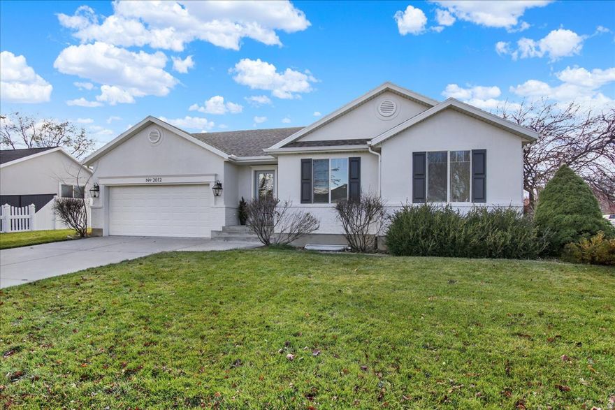 This beautiful turnkey home is everything you've been looking for-and unlike anything currently on the market. This five-bedroom, three-full-bath classic rambler has been professionally renovated down to the last detail. The home features new lighting and plumbing fixtures, fresh paint throughout, luxury vinyl plank flooring on the main level, designer-patterned carpet in the basement and on the stairs, new doors, and elegant wall moulding. The brand-new white kitchen offers expanded pantry space, quartz countertops, a large farmhouse sink, and new stainless steel appliances. Just off the kitchen, you'll find a charming newly added butler's pantry adorned with eye-catching wallpaper and butcher block countertops-the perfect spot to store your baking appliances and ingredients. A new laundry area has also been created with added cabinetry for convenience. You'll appreciate the extra-large storage room, thoughtfully located for easy access. The exterior has been completely refreshed with added trim, new paint, stylish lighting, and a lovely glass front door, giving the home an elevated look. Situated on a beautiful corner lot with a fenced yard in a friendly, quiet neighborhood, this property offers stunning mountain views and tree-lined streets. Don't miss your chance to tour this gorgeous home at our open house this Friday and Saturday, November 7th and 8th!   Square footage figures are provided as a courtesy estimate only and were obtained from Seller.  Buyer to verify all.