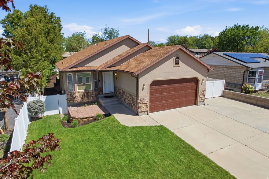 Rare opportunity to own a 5 bedroom home in Sandy Utah with 2 kitchens, 2 laundry rooms, and a separate basement entrance, perfect for multi-generational living, house hacking, or rental income. Recent updates include new LVT flooring, new carpet upstairs, newer appliances, soft-close cabinets. Additional features include solar panels, RV parking with 30-amp plug, detached single garage + attached double garage, and 2 water heaters. Located in the heart of Salt Lake County along the Wasatch Front, this home offers mountain views, vaulted ceilings, and 2 fireplaces, along with a spacious primary suite featuring a walk-in closet. Enjoy a fully fenced backyard with mature landscaping, auto irrigation, covered patio, garden area, natural gas BBQ, and hot tub included. Conveniently located near Rio Tinto Stadium, Mountain America Expo Center, The Shops at South Town, and just minutes from hiking, biking, and outdoor recreation. If you're searching for a home with a basement apartment in Sandy Utah, this is one you don't want to miss. Schedule a showing right away.
